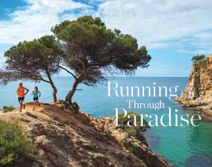 Group running by a beach in the Costa Brava