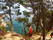 Running by a tree in the costa brava